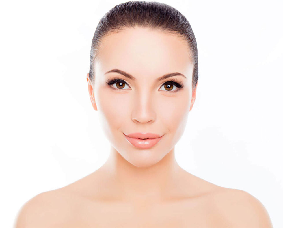 Gorgeous model with hair pulled back with smooth, glowing skin.